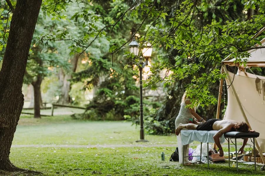 A massage session at the holistic spa, under the trees in the park